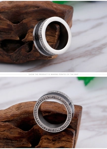 Detail of titanium steel ring with double-row crystals and black carbon fiber inlay