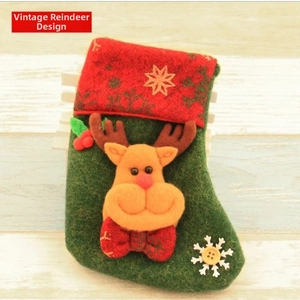 Detail of Christmas stocking with 3D reindeer mascot and snowflake embroidery decorations
