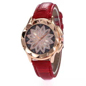 Detailed macro view of a rose gold petal bezel watch with a red crocodile leather strap