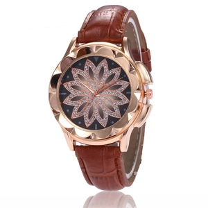 Women's rose gold watch with sparkling diamond floral dial and brown leather strap
