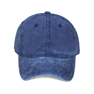 Detailed view of navy blue washed cotton baseball cap with reinforced stitching and eyelets