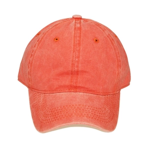 Detailed close-up of washed cotton kids baseball cap in coral red with vintage texture