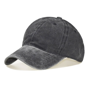 Detail showing the washed cotton fabric texture and stitching of the dark grey baseball cap