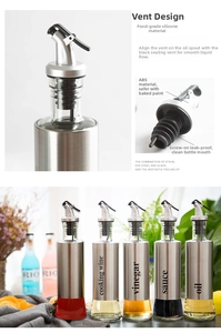Detail view of leak-proof stainless steel oil bottles with silicone stoppers and air vents