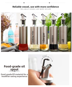 Detail of oil and sauce bottles with stainless steel shell and one-hand flip top lid