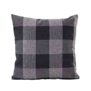 Professional studio shot of a square linen buffalo check throw pillow in black and white