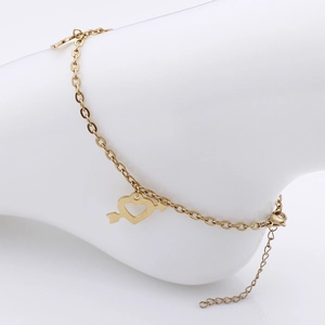 Fashionable gold titanium steel anklet with heart and arrow pendant on foot model