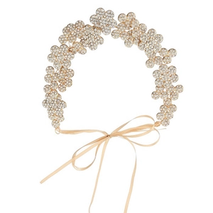 Detailed close-up of handmade gold bridal headband with sparkling rhinestone flower motifs
