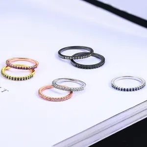 Minimalist stackable cubic zirconia rings in rose gold, silver, gold, and black finishes
