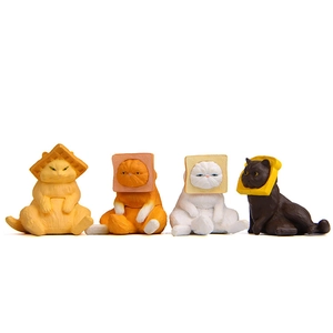 Detailed view of four colorful Japanese cat figurines with bread-shaped headgear decor