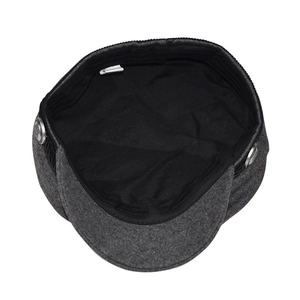 Detail view of newsboy cap lining with sweatband and vintage embossed silver button
