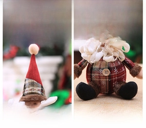 Detail of Santa plush ornament featuring a red knitted hat and white fluffy beard