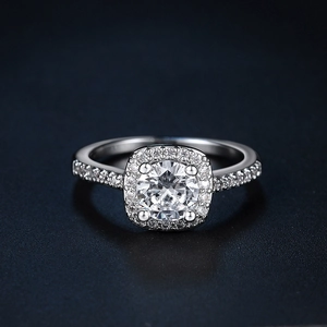 Classic halo engagement ring with round zircon center stone and diamond accents