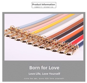 Detail showing various colors of slim PU leather belts with gold pin buckles for women