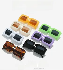 Detailed view of square sunglasses in multiple colors including orange white and green