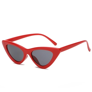 Stylish red cat eye sunglasses with dark lenses for women in a vintage triangle frame design