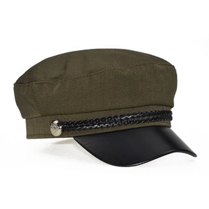 Close-up of olive green newsboy hat with black visor and decorative braided rope detail