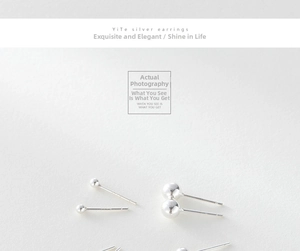 Detailed view of multiple sizes of polished 925 sterling silver ball stud earrings