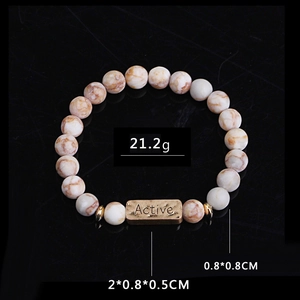 Detail of beaded bracelet with marble stone, gold Active tag, weighing 21.2g