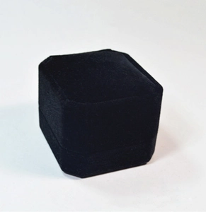 Close-up of a premium black velvet square jewelry box for rings in a closed position