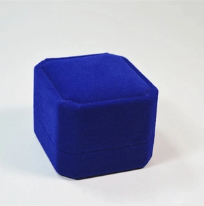Blue velvet jewelry box with beveled corners for rings and small stud earrings