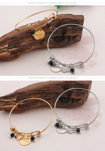 Detailed view of adjustable MOM bracelets in gold and silver with engraved charms