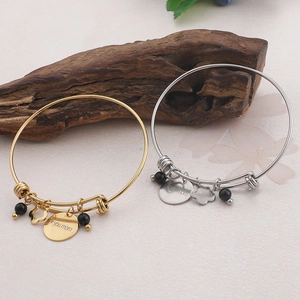 Silver and gold MOM love you charm bracelets with floral and bead details for Mother's Day