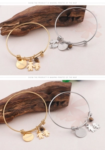 Detail of adjustable bangle with 'I love you mom' charm and tiger eye stone bead