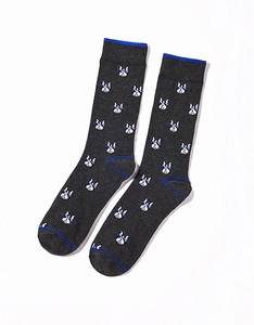 Detailed knit texture of dark grey cotton socks featuring blue accents and white bulldog patterns