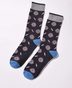 Detail of dark grey crew sock featuring blue heel and toe with colorful dartboard pattern
