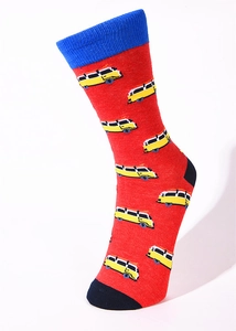 Detail of red cotton crew sock featuring blue rib cuff and yellow retro camper van pattern