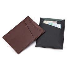 Macro shot of slim PU leather passport holders showing durable stitching and card slots