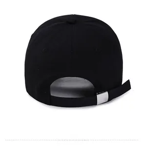 Detail of black cotton baseball cap back with adjustable silver metal buckle and strap