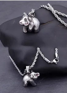 Macro detail of retro 316L stainless steel giant panda pendant with twisted rope chain