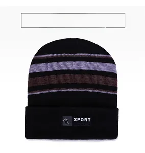 Close-up of black knitted beanie with purple stripes and sport-themed textile label
