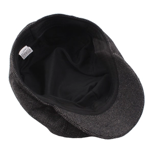 Dark grey herringbone newsboy cap made of 65% cotton blend with detailed inner lining