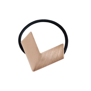 Minimalist rose gold metallic V-shaped hair tie with a sleek brushed texture on white background