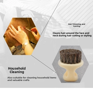 Detailed view of boar bristle barber neck brush with ergonomic beige handle and dark bristles