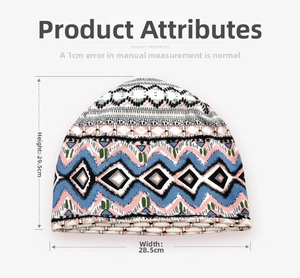 Flat lay of ethnic geometric pattern beanie showing dimensions 28.5cm wide and 29.5cm high