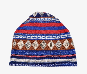 Detailed close-up of Bohemian geometric knit texture in vibrant blue and red patterns
