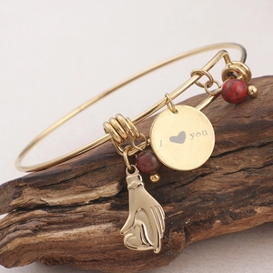Gold adjustable bangle with marble bead, heart charm and LOVE YOU engraved disc on wood branch