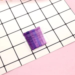 Set of 10 purple glitter wavy metal hair clips for girls on a white grid background