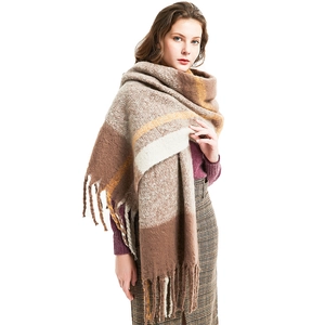 Thick plaid scarf with tassels in brown and beige colors for winter warmth