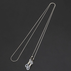Silver thin copper chain eyeglasses strap with white silicone non-slip loops on black background