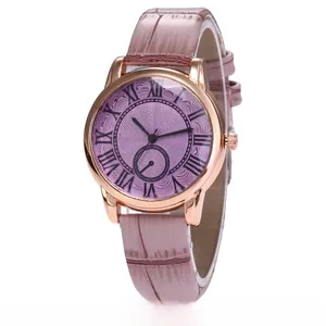 Detail view of stylish women's watch with purple wave dial and pink crocodile leather strap