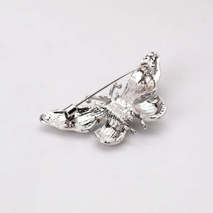 Silver alloy butterfly brooch pin showing back side structure on white background