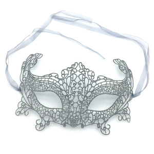 Detailed view of silver lace masquerade mask with glitter finish and ribbon ties