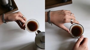 Lifestyle shot of S925 sterling silver square rings and curb chain with coffee props
