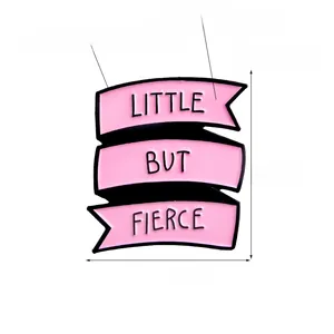 Detailed view of pink enamel pin with Little But Fierce banner and black plating