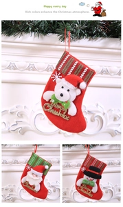 Detail of Christmas stocking ornaments featuring Santa, snowman, and polar bear figures